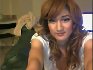 Asian teen CD videos her flat chest onthe webcam